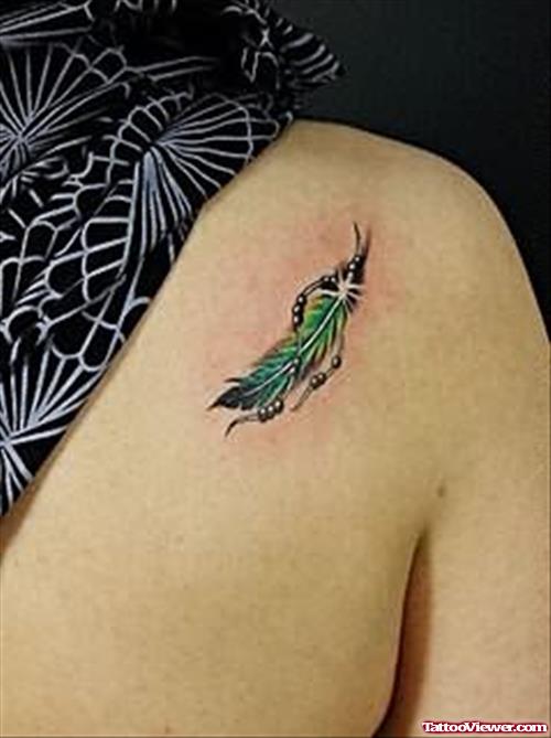 Cute Green Feather Tattoo On Back