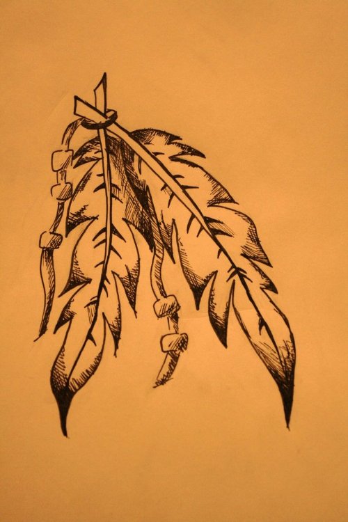 Awesome Native Feather Tattoo