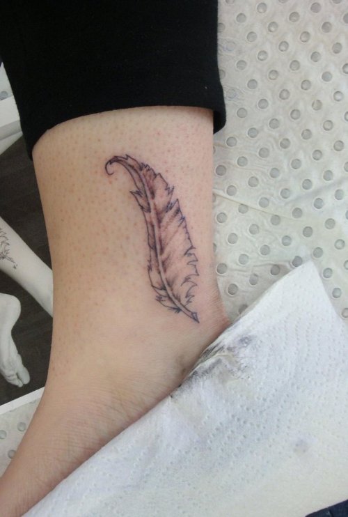 Small Grey Ink Feather Tattoo