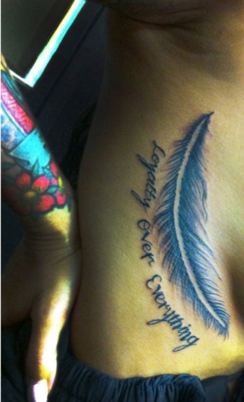 Loyalty Over Everything Feather Tattoo On Side