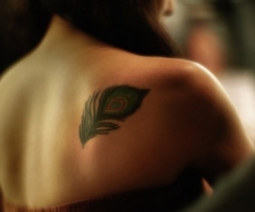 Crazy Peacock Feather Tattoo On Right Back Shoulder