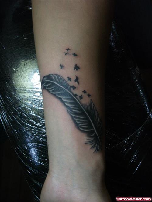 feather with birds tattoo