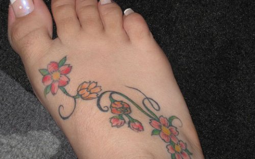 Colored Flowers And Feet Tattoo