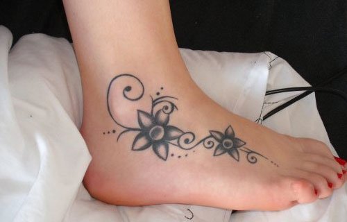 Awesome Grey Flowers Feet Tattoo For Girls