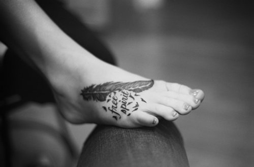 Black Ink Birds Flying From Feather Foot Tattoo