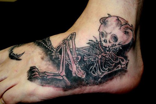 Grey Ink Skeleton Tattoo On Foot