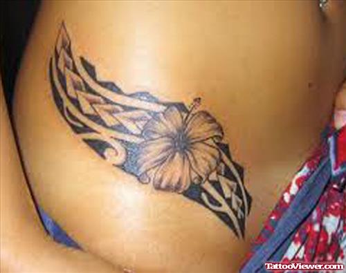 Polynesian And Flower Feminine Tattoo On Hip