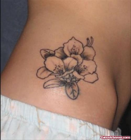 Grey Ink Flower Feminine Tattoo On Side Rib