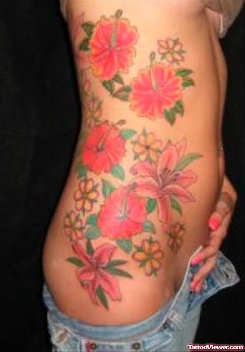 Colored Flowers Feminine Tattoo On Side Rib