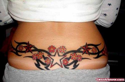 Tribal And Stars Feminine Tattoo On Lowerback