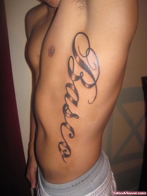 Grey Ink Feminine Tattoo On Side Rib