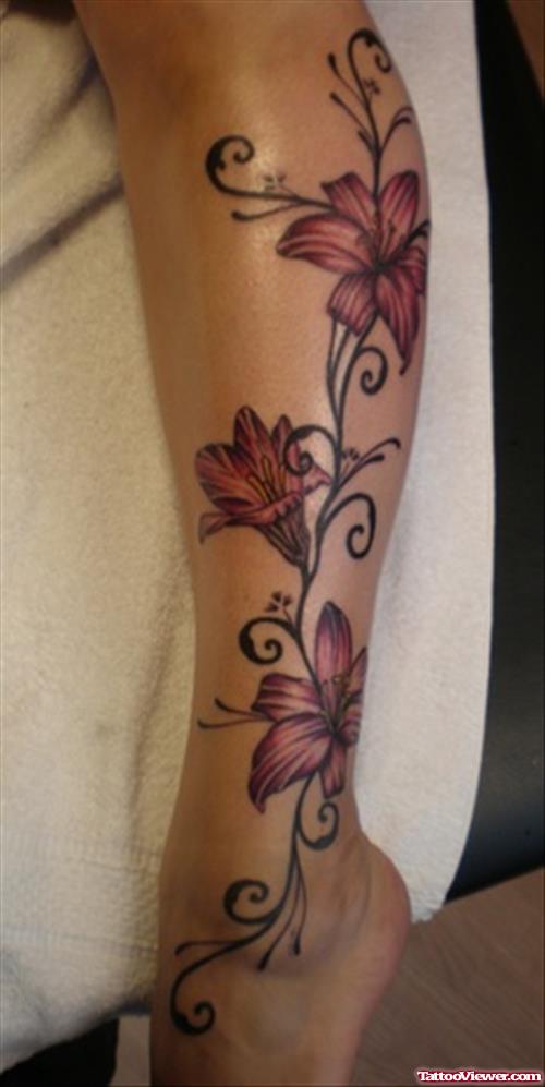 Red Ink Lily Flower Feminine Tattoo On Leg