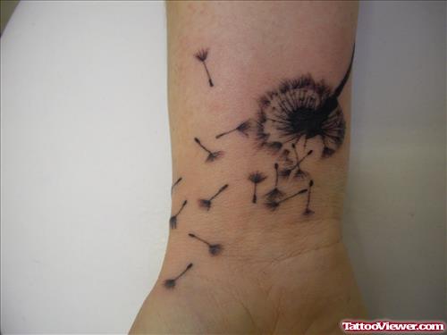 Grey Ink Dandelion Puff Feminine Tattoo On Wrist