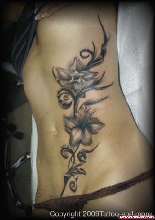Grey Ink Flowers Feminie Tattoo On Back