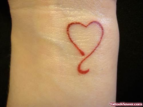 Attractive Tiny Red Heart Feminine Tattoo On Wrist