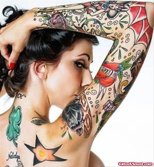 Feminine Tattoo On Back And Right Sleeve