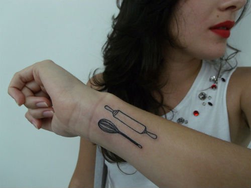 Egg Beater And Chapati Roller Feminine Tattoo On Arm