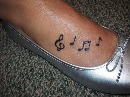 Music Notes Feminine Tattoo On Girl Foot