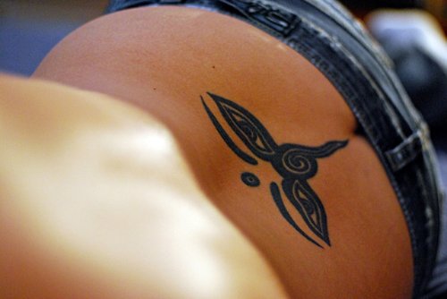 Tribal Feminine Tattoo On Lowerback