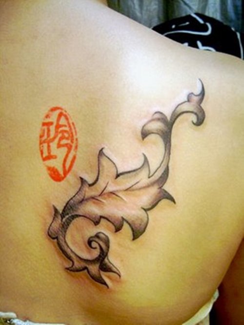 Attractive Feminine Tattoo On Back Shoulder