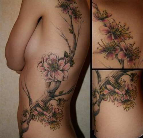 Feminine Flowers Tattoo On Side Rib