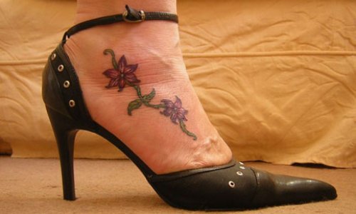 Colored Flowers Feminine Tattoo On Foot