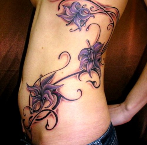 Purple Flowers Feminine Tattoo On Rib Side