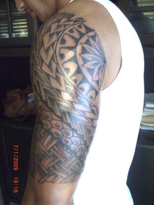 Grey Ink Filipino Tattoo On Man Left Half Sleeve