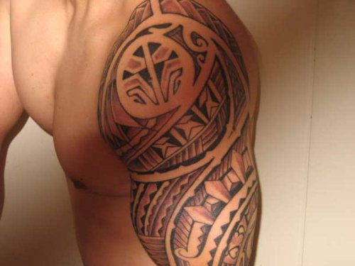 Grey Ink Filipino Tattoo On Man Left Sleeve