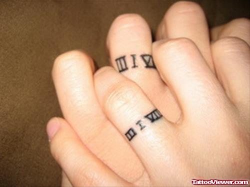 Roman Numerics Finger Tattoos