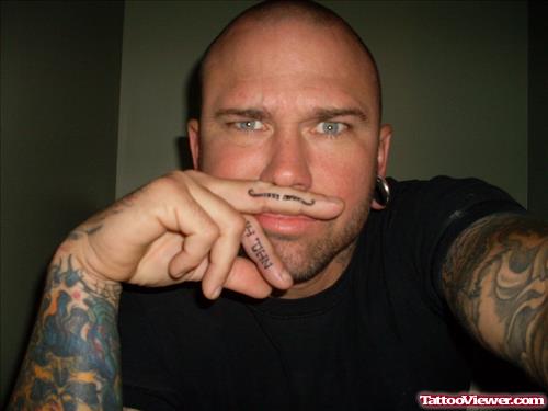 Man With Mustache Finger Tattoo