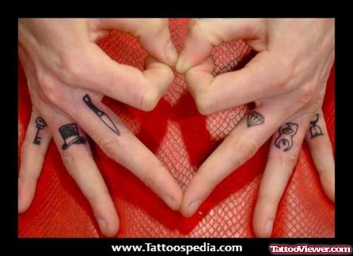 Tooth, Diamond And Knife Finger Tattoos
