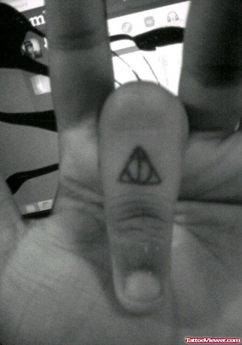 Small Triangle Finger Tattoo