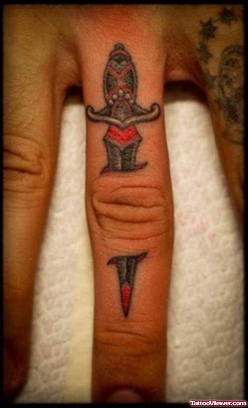 Ripped Skin Dagger Finger Tattoo