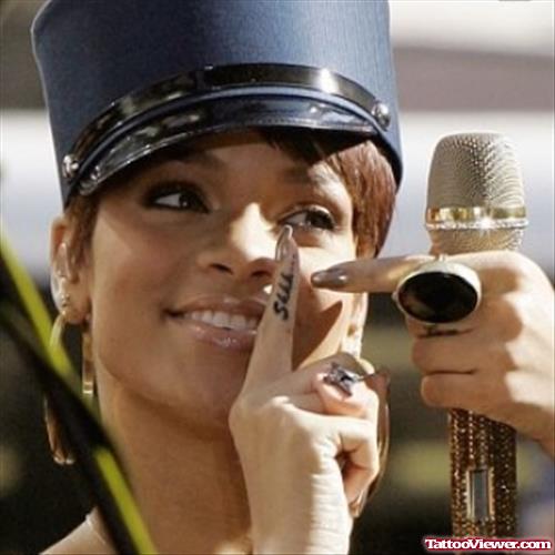 Rihanna Showing Her Shhh Finger Tattoo