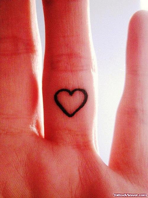 Outline Tiny Heart Finger Tattoo
