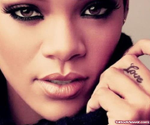 Rihanna With Love Word Finger Tattoo