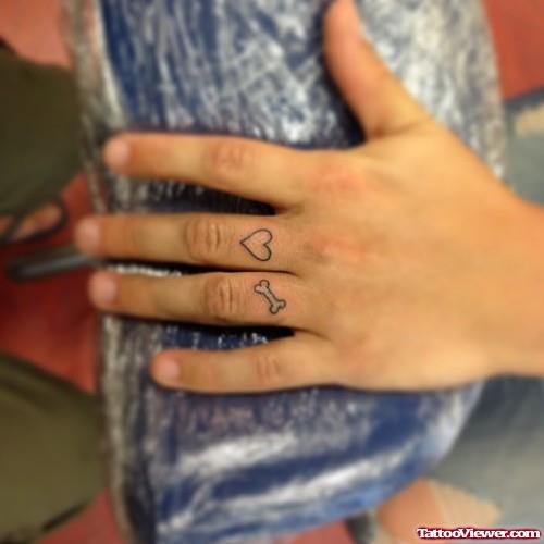 Heart And Bow Finger Tattoo
