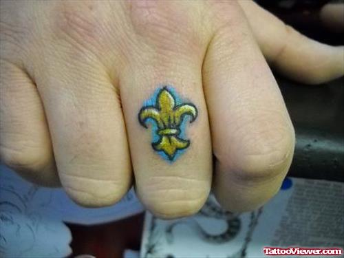 Fleur De Lis Finger Tattoo