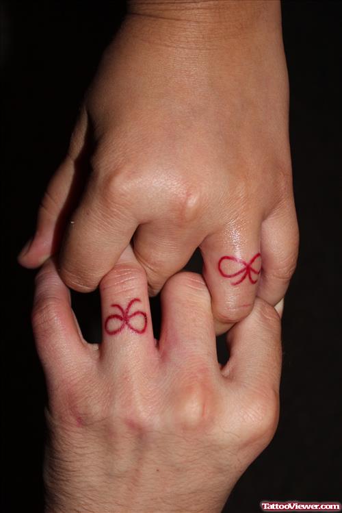 Red Ink Bow Finger Tattoo