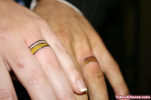 Colored Wedding Ring Finger Tattoos