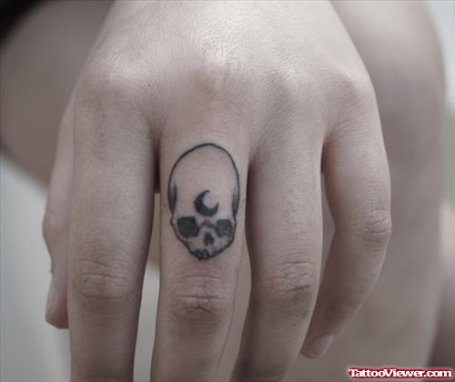 Grey Ink Alien Skull Finger Tattoo