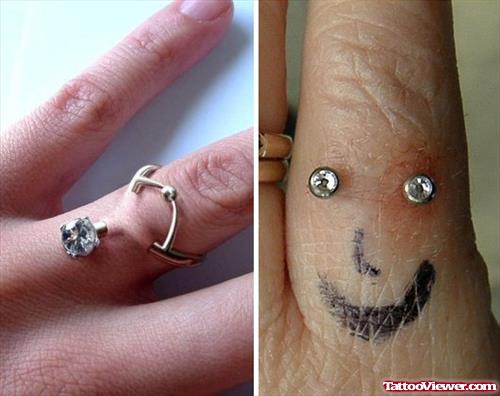 Finger Smiley Tattoo And Piercing