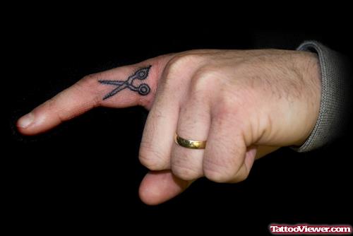 Black Ink Scissor Finger Tattoo