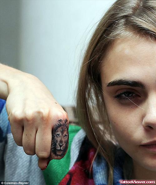 Girl Showing Her Lion Head Finger Tattoo