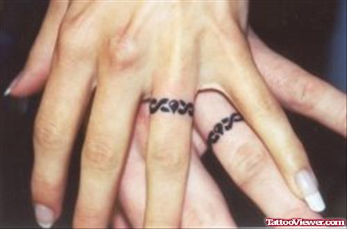 Couple With Finger Tattoo