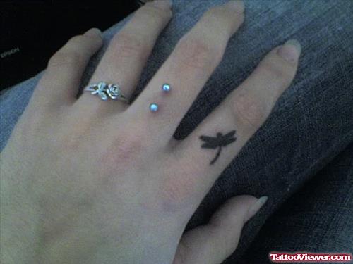 Black Ink Dragonfly Finger Tattoo