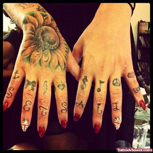 Flowers And Symbols Finger Tattoos