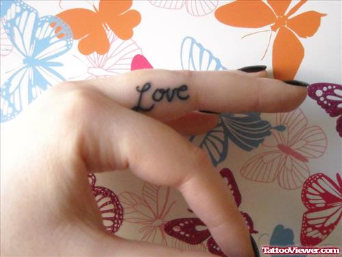 Black Ink Love Word Finger Tattoo
