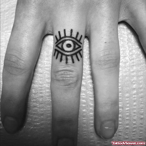 Black Ink Eye Finger Tattoo